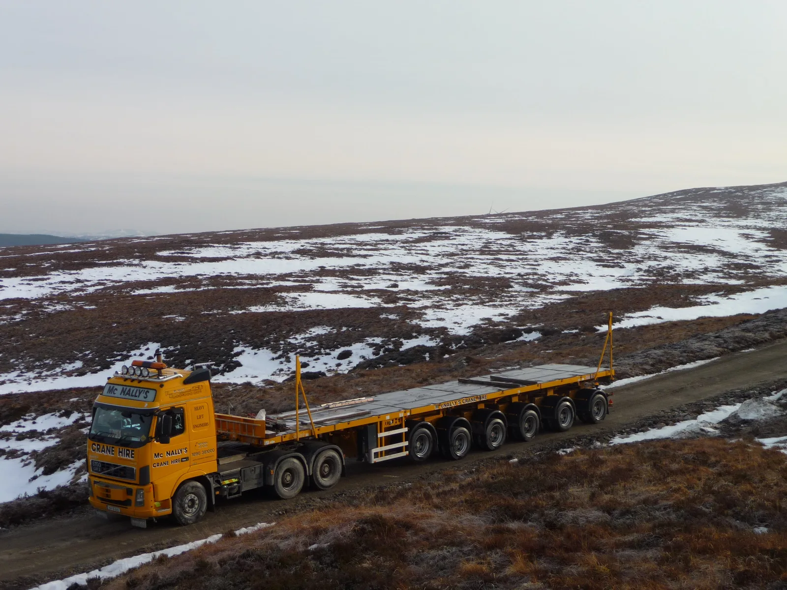 McNally’s low-loader on the snowy access road at Achany wind farm, Scotland
