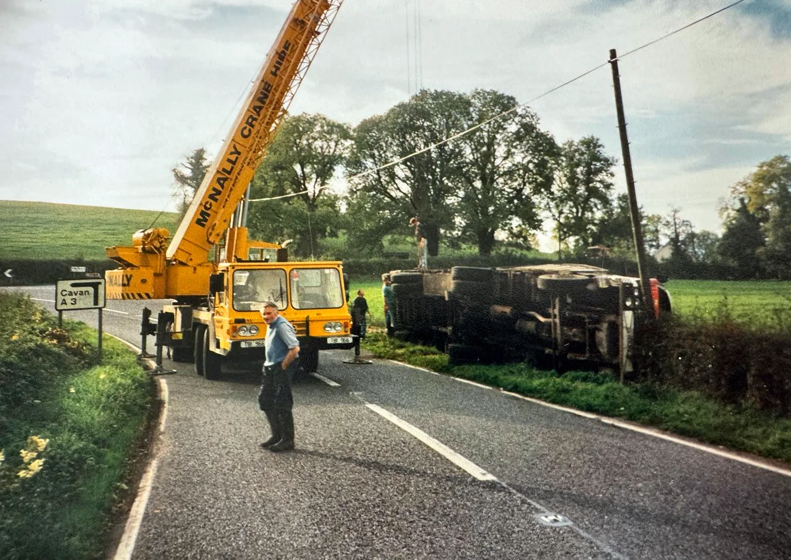 Archive photograph of a McNally’s mobile crane and operator at the roadside