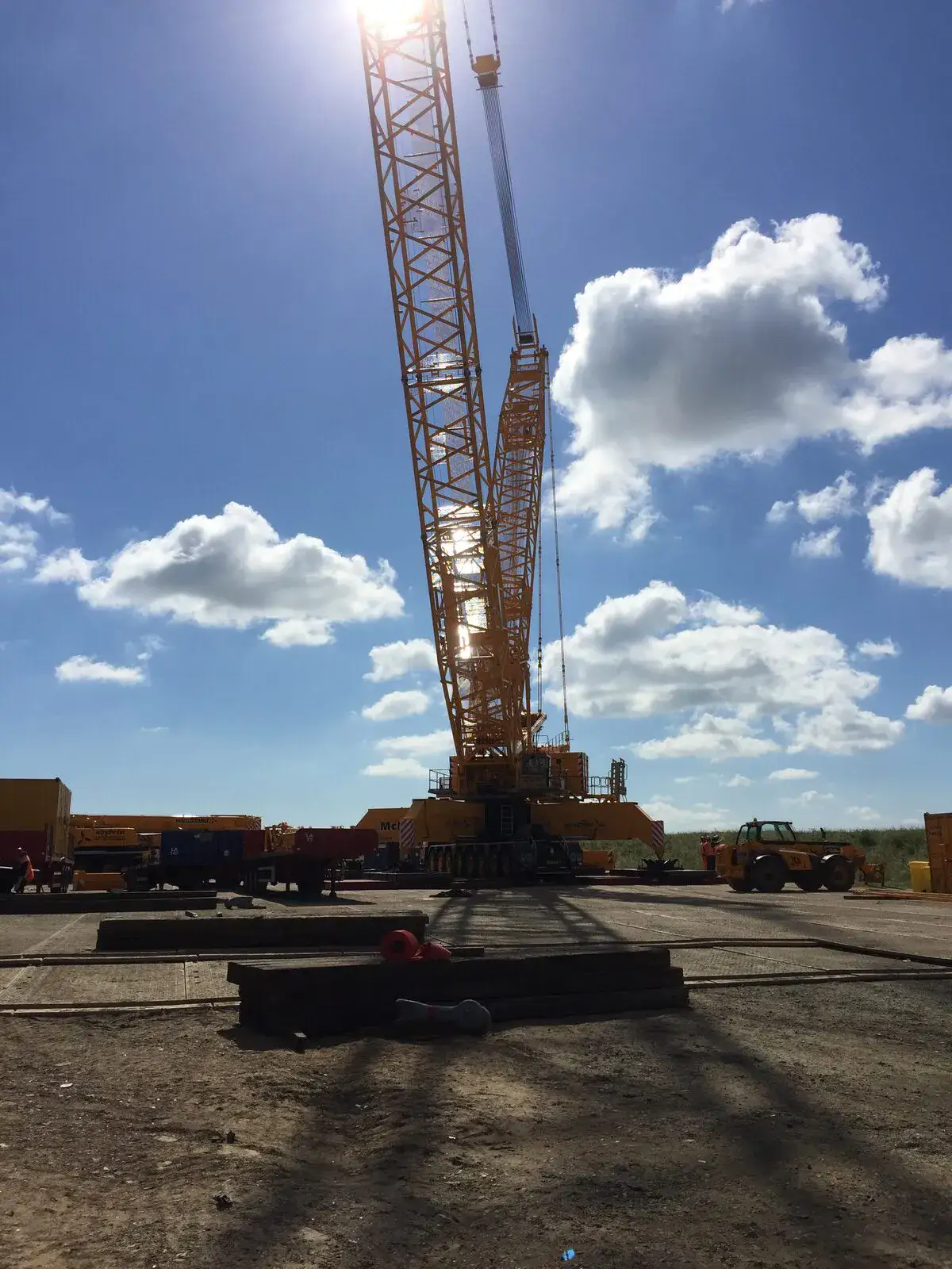LG1750 crawler crane against a blue sky with cloud