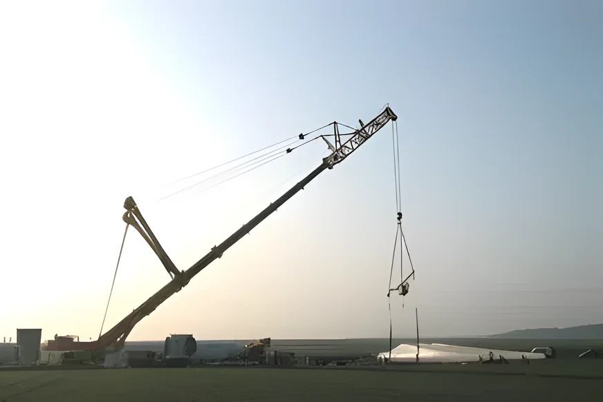 Liebherr LTM 1200 working on a flat site at dusk