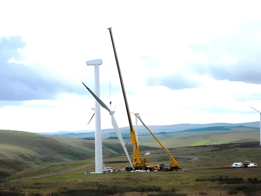 Liebherr LTM 1300 and an assist crane erecting a turbine on an upland wind farm