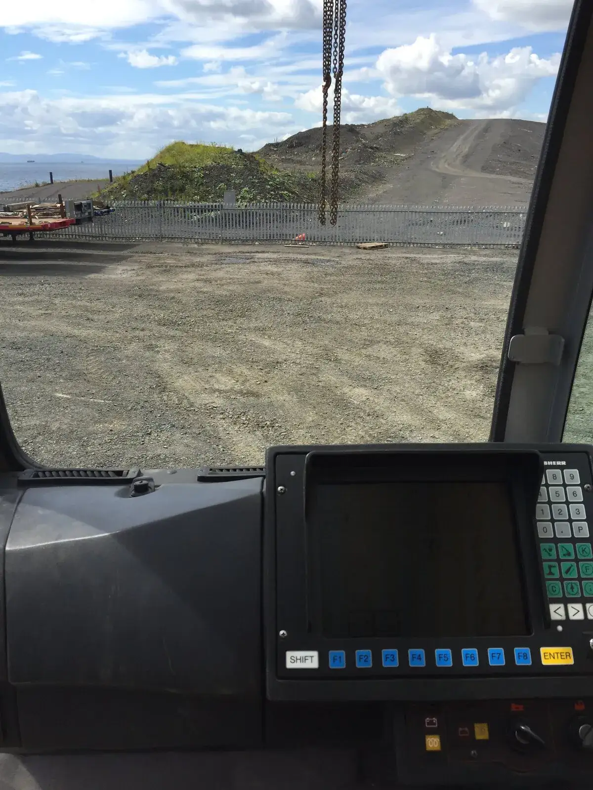 Inside the crawler crane cab at Methil, with the control screen and keypad