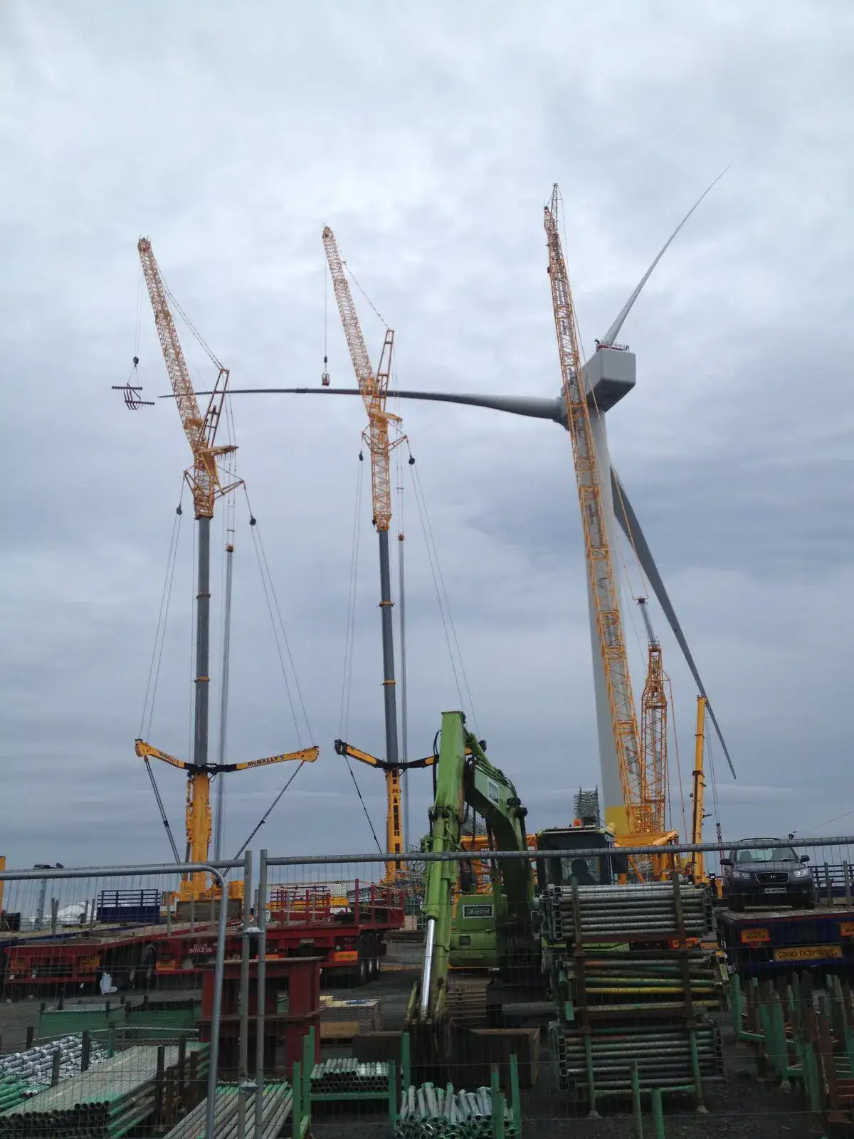 Three cranes beside the wind turbine at Methil