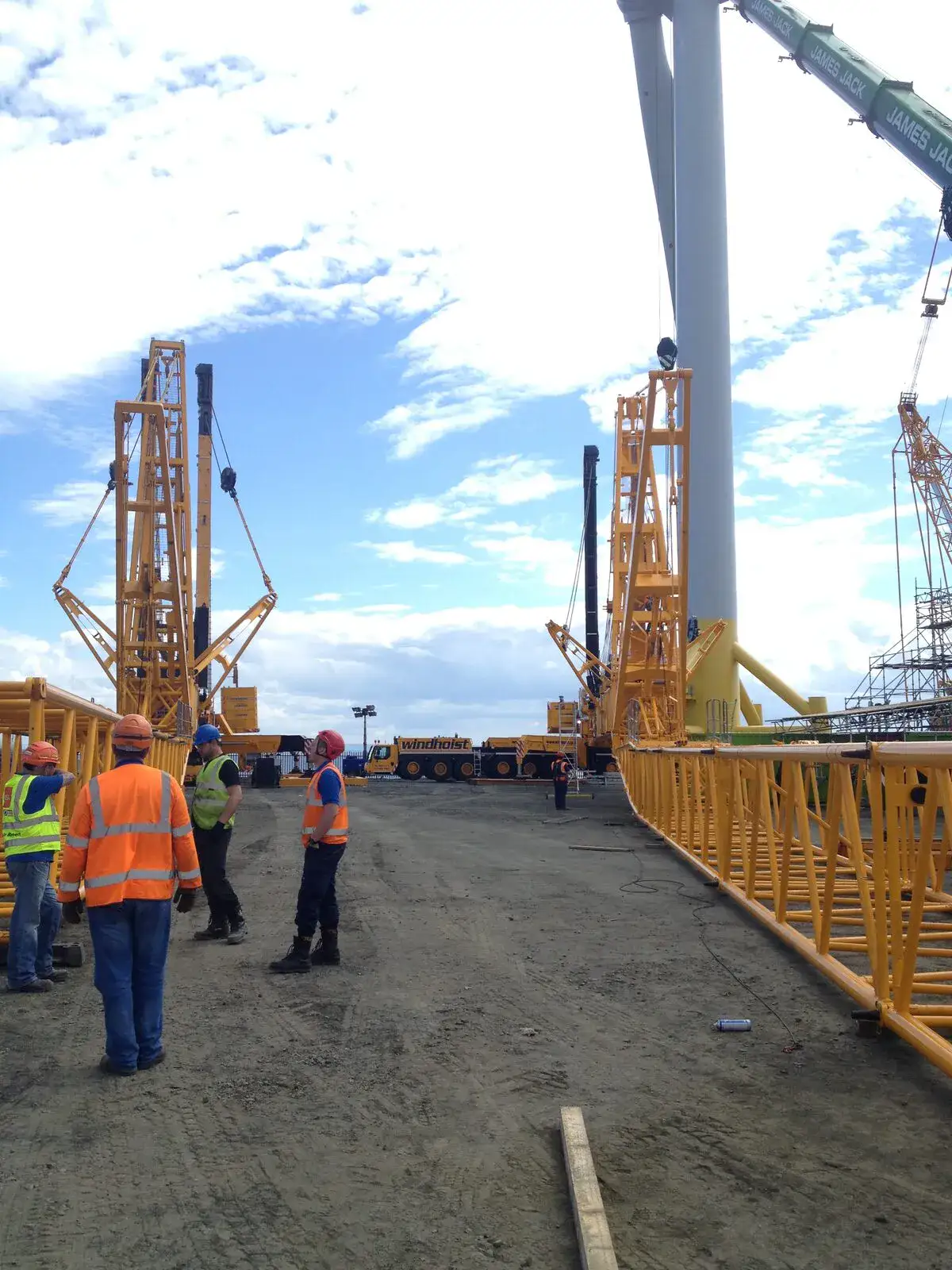 Crew in hi-vis on the quay beneath the turbine at Methil