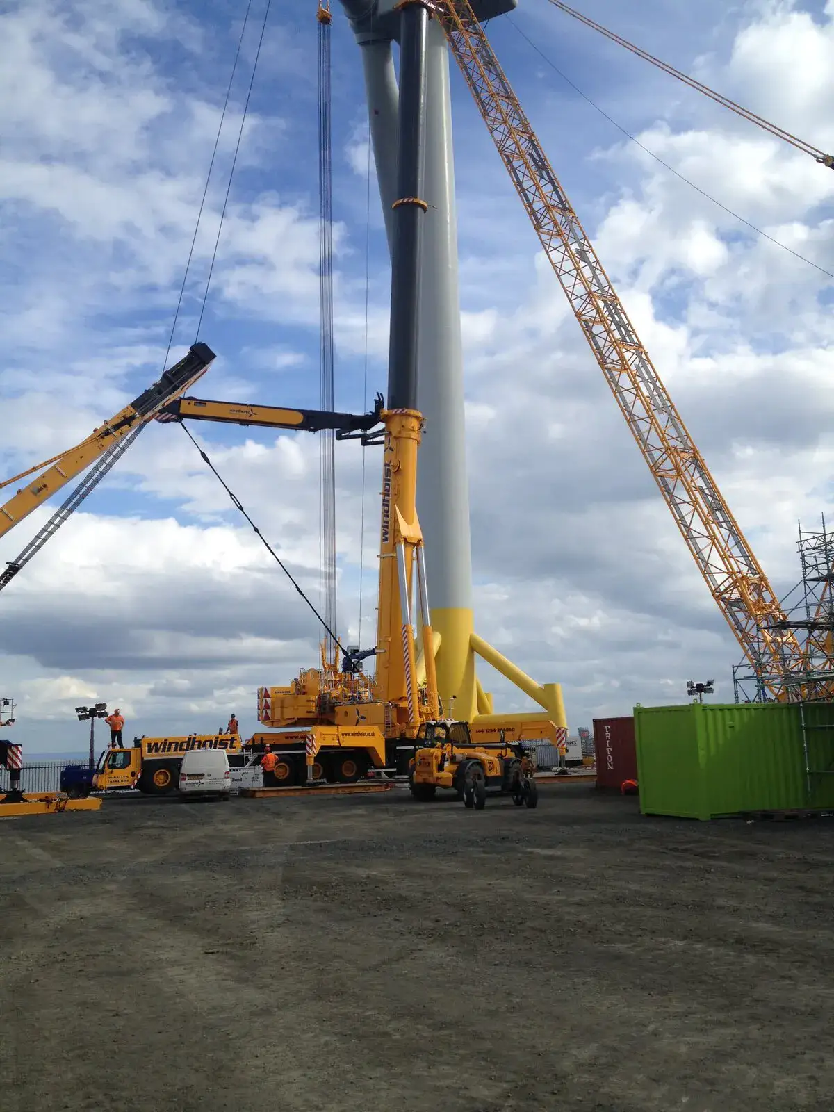 Crawler cranes working at the base of a wind turbine at Methil