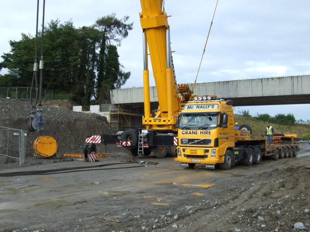 McNally’s Volvo low-loader and a Liebherr all-terrain crane rigging at a road bridge site in 2007